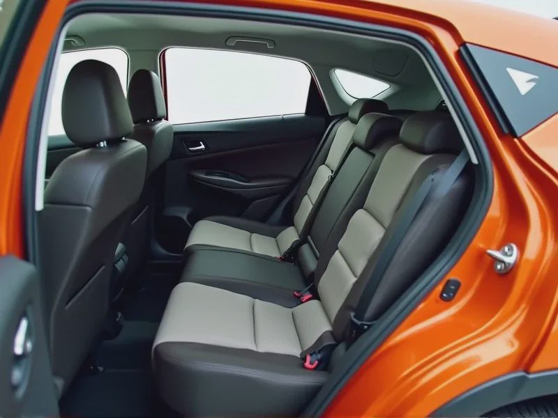Viewed from the side-opening door, the HR-V’s rear seat cushion is clearly shown folded upward and secured to the backrest.